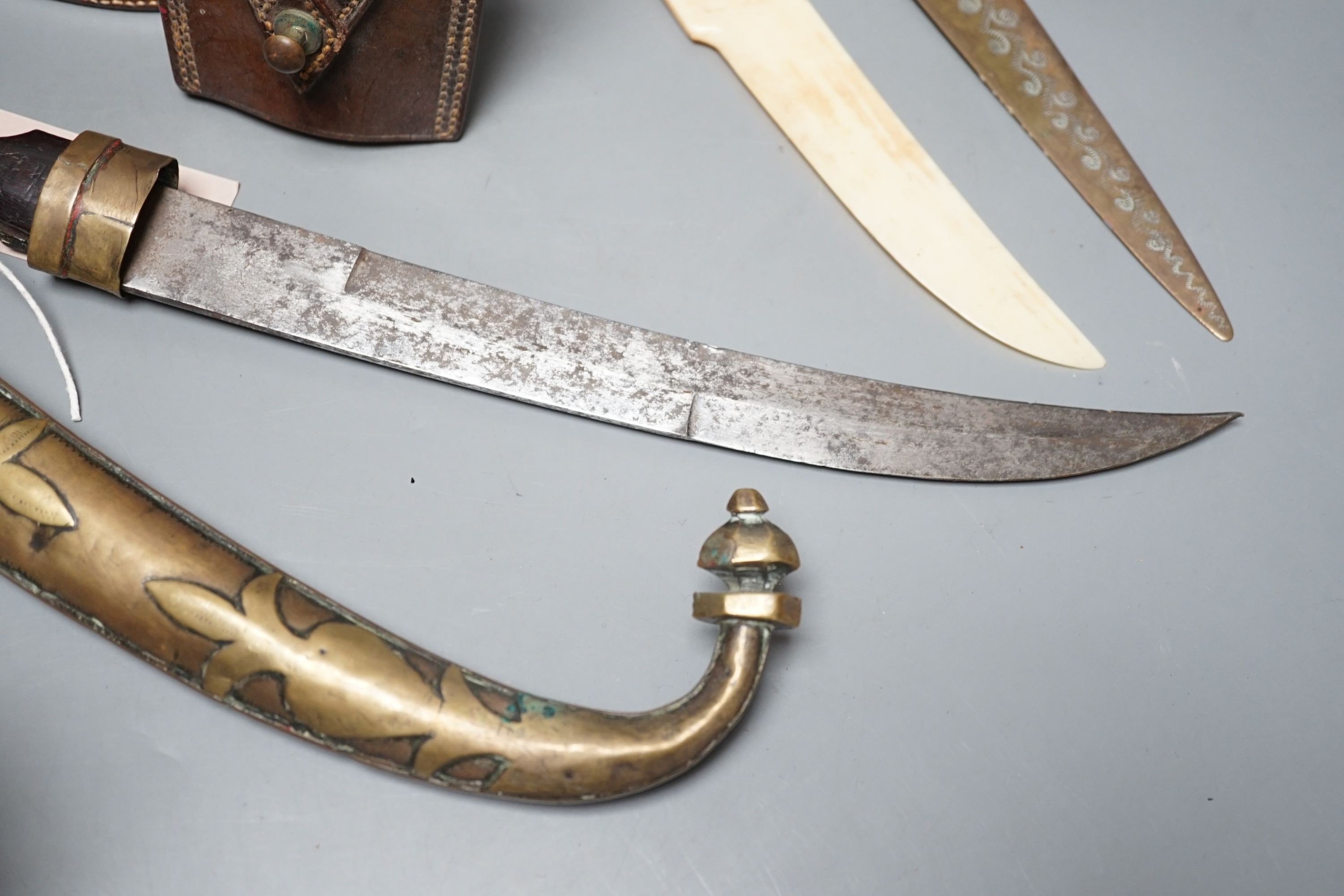 An Eastern dagger, in sheath, leather collars box, cased early 20th century Dollond compass and three others